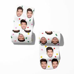 the faces of two men with confetti on them are printed onto toilet paper