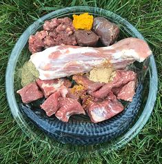 meat and spices in a bowl on the grass