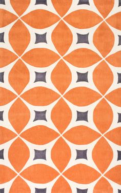 an orange and blue rug with circles on it