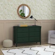 a living room with a green dresser and mirror