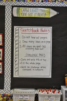 a bulletin board with writing on it and other items in containers next to the chalkboard