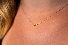 Literally the most elegant, beautiful, dainty citrine birthstone necklace you will ever wear. This tiny (and I mean TINY for that delicate feminine aesthetic) citrine stone will set you apart like no other gemstone. What a stunningly beautiful, impressive gift to let that special someone know just how important they are to you. DETAILS Your new made to order tiny citrine necklace will consist of a dainty citrine bead measuring 4mm across, hand carved with a delicate .8mm 925 silver box chain str Dainty Amber Citrine Jewelry, Dainty Citrine Necklaces Perfect For Gifts, Dainty Citrine Necklace For Gifts, Dainty Amber Sterling Silver Jewelry, Elegant Amber Birthstone Necklace For Gift, Gold Faceted Birthstone Necklace, Delicate Citrine Jewelry For Gifts, Amber Birthstone Dainty Necklace, Amber Birthstone Necklace For Anniversary