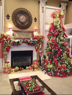 a living room decorated for christmas with red and green decorations