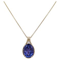 Beautiful 15.45 ct. tanzanite oval with 0.05 ct. white diamond rounds. Handmade in 14k yellow gold. Length is 18". Luxury Oval Tanzanite Necklaces, Elegant Oval Tanzanite Jewelry, Elegant Yellow Gold Tanzanite Necklace, Elegant Oval Tanzanite Necklaces, Elegant Yellow Gold Tanzanite Necklaces, Gold Tanzanite Oval Jewelry, Formal Tanzanite Oval Pendant Jewelry, Oval Tanzanite Necklace Fine Jewelry, Yellow Gold Tanzanite Oval Necklace