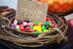 a basket filled with lots of candy sitting on top of a table