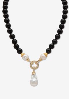 This elegant genuine black agate and Keshi pearl necklace is dripping with style. Accented with 1.72 carats T.W. sparkling pave' set white cubic zirconia. Two looks in one, it can be worn with or without the Keshi drop pearl. 20" length. Gold-plated.FABRIC: GoldtoneMain Stone: 1 Round Freshwater-Cultured Pearl, 14 mm x 14 mm2 Round Freshwater-Cultured Pearls, 11 mm x 11 mm38 Round Buff Top Cut Genuine Black Agate, 10 mm x 10 mm52 Round Faceted Cut Cubic Zirconias, 1.72 carats total weight, 2 mm Pearl Necklace Designs Unique, Modern Necklace Design, Black Jewelry Necklace, Black Pearl Jewelry, Black And White Necklace, Baroque Jewelry, Black And White Necklaces, Keshi Pearl Necklace, Pearl Drop Necklace