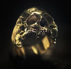 Our 18kt. Gold Decayed Halfjaw Skullring is a representation of an anatomically correct decaying skull, of which the detail and accuracy is unparalleled, even things like the nasal cavity is sculpted in.Weighing in at 43 grams of carefully casted 18kt. Gold of the highest quality, each piece is finished separately by hand to ensure perfect quality.Each order is shipped in a luxurious wooden case which is completely handmade. Decaying Skull, Family Crest Rings, Nasal Cavity, Man Stuff, Premium Packaging, Skull Jewelry, Skull And Crossbones, Wooden Case, Skull Ring