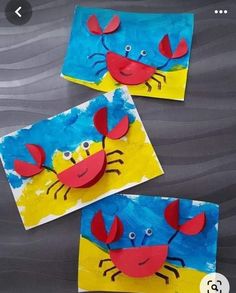 two crab puppets made with construction paper and glue