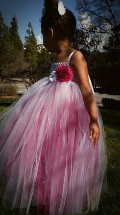 This fancy dress is made with layered magenta pink tulle underneath a layer of white tulle. A beautiful magenta pink colored flower with center embellishments adorns the top as well as a stylish white flower with center rhinestones. Adjustable straps tie in a bow at the back of the dress for a stunning look. You are welcome to customize this dress, please message us with questions. Many colors are available, message us with colors you prefer, we love to customize! Standard sizing chart is used, Sweet Pictures, Dress Fancy, Lovely Eyes, White Tulle, Handmade Kids, Magenta Pink, Pink Tulle, Baby Dresses, Tutu Dress