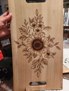 a wooden box with an image of a sunflower on it