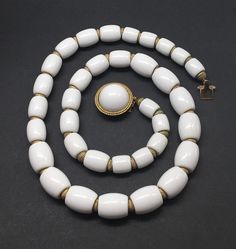 "Beautiful vintage crown Trifari plastic lucite white bead alternating gold tone necklace good pre/owned condition measures 20\" length." White Beaded Necklace For Formal Costume Jewelry, White Polished Beads Costume Necklaces, Vintage White Single Strand Necklace, White Polished Beads Costume Necklace, Formal Gold Lucite Jewelry, Vintage White Enamel Necklaces, Modern White Lucite Jewelry, Crown Trifari, Pearl Cluster