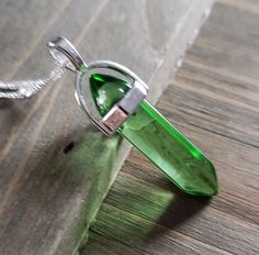 Beautifully elegant 925 sterling silver plated stainless steel water ripple necklace translucent green aventurine crystal. Be sure to check out more HANDMADE jewelry in my shop, DizzleBees, beautiful jewelry of all kinds available! Made with quality materials and always nickel and lead free metals ♡ Perfect gift for a friend or loved one: All jewelry pieces are packaged in silver silk jewelry pouches, wrapped carefully, and packaged with love. Beautiful wrapping for gift ready giving. Personaliz Silver Pendant Crystal Necklace For May Birthstone, Green Pendant Crystal Necklace Nickel Free, Green Pendant Crystal Necklace, Nickel Free, Silver Crystal Necklace For May Birthstone, Silver Crystal Necklace For May Birthstone Gift, Green Faceted Jewelry As Gift, Green Round Crystal Necklaces As Gift, Green Round Crystal Necklaces For Gift, Green Round Crystal Necklace Gift