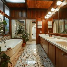 a large bathroom with two sinks and a bathtub next to a plant in the corner