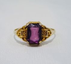 The past will always return in the fashion world and this piece is back for round two! In the 1920's ladies of class wore the most opulent dresses with jewelry to match. As the years continued, jewelry makers tailored pieces to fashion and trends which resulted in affordability for style. Presenting this Beautiful Vintage 10k Gold Old Mine Cushion Cut Amethyst Solitaire Ring Featuring Elegant Victorian Inspired Designs. Approximate Size: Ring Size 6 and 1.1 grams total weight. Stone measures 8mm Round Two, Jewelry Maker, Cushion Cut, 10k Gold, Solitaire Ring, Class Ring, Sapphire Ring, Sapphire, Amethyst