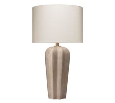 a white lamp with a beige shade on it's base and a light bulb in the shape of a rectangle