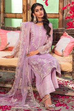 Luxury Lilac Organza Pakistani Salwar Kameez Dupatta Salwar Suit embodies the concept of beauty with a subtle touch. The organza shirt is decorated with white thread embroidery with motif details. The front is adorned with silver sequin and adda work embellishments to enhance the look. The outfit comes with Pakistani raw silk culottes topped with a net embroidered dupatta. Organza Kameez: The kameez in organza fabric is emblazoned with lavish floral designs and embroidery. Beaming sequins and th White Thread Embroidery, Shalwar Design, Lavender Outfit, Organza Suits, Organza Shirt, Pakistani Salwar, Raw Silk Fabric, Pakistani Salwar Kameez, Suits Design