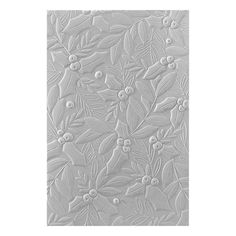 a decorative paper with holly leaves and berries on the edges, in silver foiling