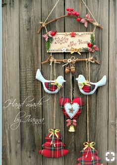 a wooden fence with two birds hanging from it