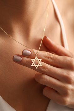 "Star Of David Necklace a symbol of the Jewish faith and has great design with any name or text on it. Also perfect for daily use. It can become your Great option as Jewish Necklaces. Lets personalize with any name your perfect personalized jewelry! 💖Magen David Necklace & Star of David charm will become your and your loved ones favorite.  🎁Make ready your favorite dainty necklace for any special occasion. You have silver necklace and gold star of David necklace options. ✋All our personalized gifts %100 custom made by hand with Love and Care in our workshop! Nickel Free High Quality Materials *How to customize your Jewish Jewelry? Leave a not at \"Note to seller\" with name that you would like to have on Jewish star necklace. Please specify uppercase and lowercase letters. The necklace w Symbolic Star Of David Engraved Necklace, Symbolic Star-shaped Engraved Necklaces, Symbolic Star Of David Necklace For Gift, Star-shaped Engraved Necklace For Gift, Hanukkah Gift Necklace With Star Of David, Symbolic Star Necklace Gift, Star Of David Necklace For Hanukkah Gift, Star Of David Necklace For Gift, Personalized Star-shaped Necklace For Gifts