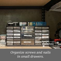 organized screws and nails in small drawers on the shelf next to an open toolbox