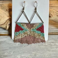 Both pair of fringe earrings are gorgeous compliments to any wardrobe choice. One in a modern triangle pattern and the other is a traditional shimmery fringe pattern.  Nickel and lead safe. Bohemian Triangle Beaded Earrings, Bohemian Triangle Jewelry With Dangling Beads, Adjustable Triangle Beaded Earrings, Bohemian Geometric Beaded Earrings, Fringe Beaded Earrings, Stitch Earrings, Brick Stitch Earrings, Seed Bead Patterns, Triangle Pattern