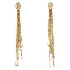 Elegant pair of vintage diamond fringe drop earrings crafted in 14k yellow gold (circa 1990s). Round brilliant diamonds total an estimated 0.25 carats (estimated at H-I color and VS2-SI1 clarity). The long and sexy fringe drop earrings measure 3 1/2 inches in length and make a great statement on the earlobe. Diamonds are set to the base of the fringe drops to catch light and offer sparkle. The earrings are great for day or evening wear & are fitted with post & butterfly backings. The earrings ar Long Fringe, Long Fringes, Earring Crafts, Pearl Earrings Dangle, Antique Earrings, Fringe Earrings, Earrings Vintage, Brilliant Diamond, Vintage Diamond