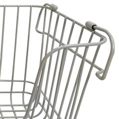 a close up of a metal basket on a white background with clippings to the side