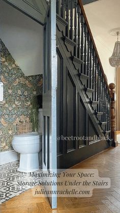 an open door leading to a bathroom next to a toilet and stairs in a house