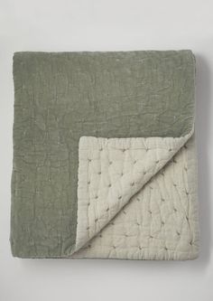 an image of a blanket with a green and white color scheme on the bottom half