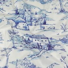 a blue and white wallpaper with houses on it