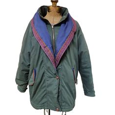 This Vintage Andy Johns Parka Jacket in small size is a must-have for any wardrobe. It features a zip and button front, crafted from a green and blue polyester-cotton blend.  * Vintage Andy Johns brand * Size: Women's small * Color: Green and Blue * Zip and button front * Material: 65% Polyester, 35% Cotton Features: * Coat * Solid * Made in Macau Size: Womens S Measurements: Chest 46 in / 117 cm Length 29 in / 74 cm Condition: Pre-Owned Good There is an area of discoloration so please be sure to see all pictures.  Orders placed with be shipped either the same or the next business day Green Cotton Outerwear With Zipper Closure, Vintage Green Outerwear For Cold Weather, Green Buttoned Outerwear For Outdoor, Green Outdoor Outerwear With Buttons, Green Outerwear With Button Closure For Outdoor, Retro Green Hooded Outerwear, Retro Green Outerwear For Outdoors, Retro Green Outerwear For Outdoor, Retro Green Outdoor Outerwear