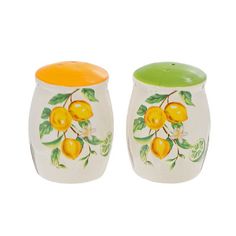 two ceramic salt and pepper shakers painted with lemons on white, one orange and the other green