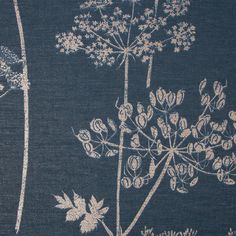 a blue and white rug with flowers on the side, in front of a black background