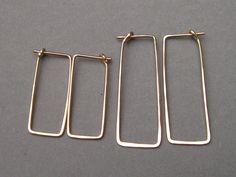 "These simple geometric dangles are shaped to easily insert and have a self closure for security. They're so comfortable you can wear them 24/7, and they go with anything. Hammered for hardness, these 19 gauge earrings are effortless and comfortable. Choose your metal and length in dropdown menu. 1 inch x 3/8\" or 1 1/2 inches x 1/2\". Made to order. Shipping ~ Domestic orders are sent USPS insured first class. Expect 3 to 5 business days for delivery from the date it is mailed. I am a 1-person Minimalist Hammered Rectangular Earrings, Minimalist Rectangular Hoop Earrings, Hypoallergenic, Minimalist Rectangular Hypoallergenic Hoop Earrings, Everyday Nickel Free Rectangular Hoop Earrings, Everyday Nickel-free Rectangular Hoop Earrings, Minimalist Hypoallergenic Rectangular Hoop Earrings, Everyday Hammered Rectangular Jewelry, Gold Minimalist Jewelry, Silver Wire Earrings