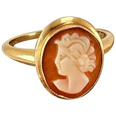 "Lovely Lady Shell Cameo Ring with flower in her hair set in 14K Gold and measuring 1/4\" by 3/8\". Size 7 1/4\". A really delicate and beautiful piece you will be sure to get compliments on! Item ID: IDRL-J80 Color: Champagne, Coral, Cream Item Type: Antique Material: 14K Gold" 14k Gold Cameo Rings For Wedding, Wedding Cameo Ring In Yellow Gold, Cameo 14k Gold Round Jewelry, Yellow Gold Flower Ring Stamped 14k, Wedding Yellow Gold Cameo Ring, Fine Jewelry Cameo Rings For Weddings, 14k Gold Cameo Round Jewelry, 14k Gold Cameo Jewelry, Vintage Flower Ring For Formal Occasion