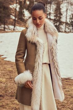 In tonal hues and with subtle sophistication, the Chantal reversible shearling coat will keep you warm while maintaining your style factor all winter long. This chic sheepskin coat is like having two distinctive looks in the same polished garment. One side displays the silky, shorn sheepskin fur, whereas the other reverses to a smooth finish that is soft to the touch. Both sides showcase distinctive fur trim around the collar, down the front, and at each cuff, making the Chantal a show-stopping Fur Cuff Coat, Tanning Hides, Alpine Chic, Coat With Fur Trim, Fashion Outerwear, Fur Trim Coat, Coat With Fur, Reversible Coat, Fur Clothing