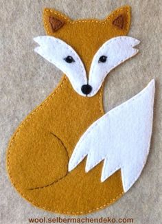 a close up of a piece of felt with a fox on it