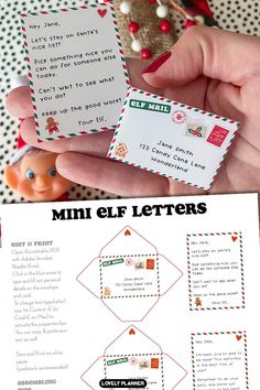 a hand holding two small christmas letter cards with the words mini elf letters on them