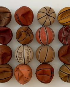 basketballs lined up in rows on a white surface