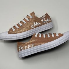 two gold and white shoes with the words mr and mrs written on them