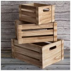 three wooden boxes stacked on top of each other