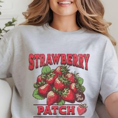 Sweeten Your Style with Our Strawberry Graphic T-Shirt! Add a touch of fruity fun to your wardrobe with our Strawberry Graphic T-Shirt. This delightful tee features a vibrant and playful strawberry design that's sure to brighten your day and bring a smile to everyone you meet. **This design falls into the category of:  Designed by a Seller This design was provided by Kittl The production partner is Printify delivered from RI, US** Comfort Colors introduces the "Comfort Colors 1717" garment-dyed t-shirt; a fully customizable tee made 100% with ring-spun cotton. The soft-washed, garment-dyed fabric brings extra coziness to your wardrobe while the relaxed fit makes it an excellent daily choice. The double-needle stitching throughout the tee makes it highly durable while the lack of side-seams Trendy Strawberry Print Crew Neck T-shirt, Cheap Fun Strawberry Print T-shirt, Fun Strawberry Print Crew Neck T-shirt, Summer Strawberry Print Graphic T-shirt, Fun Cotton T-shirt With Strawberry Print, Fruit Shirt, Strawberry Shirt, Strawberry Patch, Botanical Shirt