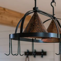 two hanging lights with hooks attached to them