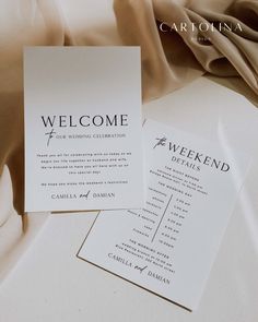 two wedding programs are laying on a bed