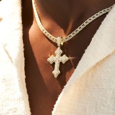 Introducing the Iced Gothic Cross in Yellow Gold - a bold addition to your pendant collection. Crafted with a durable 18k Gold and hand-set stones, this cross is guaranteed to make a statement. Pair this piece with our 5mm Tennis Chain in Yellow Gold for a complete, elevated look. This product is guaranteed for life - GLD will repair the item should you experience any defects in craftsmanship or breakage. Specifications - 35mm x 42mm (Width x Height) - Weight: (Weight can vary +/- 1 gram) - Gold Gothic Cross, Gothic Crosses, Tennis Chain, Vermeil Jewelry, Custom Earrings, Drop Necklace, Pendant Bracelet, Gold Design, Cz Stone