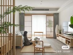 a living room filled with furniture and a flat screen tv sitting on top of a wooden table