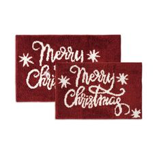 two red christmas door mats with merry lettering