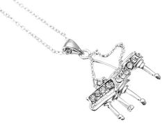 a silver necklace with an airplane on it