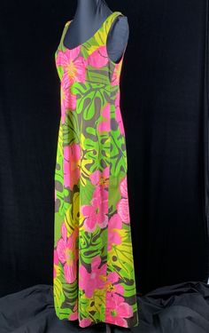 "True vintage 1970's maxi sundress bought on vacation in Bermuda, Jamaica or Barbados. This fabulous dress is marked size 14 created by Calypso. The material is a swimsuit like fabric, with body and water resistant. Size: Medium Bust: 37\" Waist: 32\" Hips: 38\" Shoulder to Hem: 57\" Excellent condition, there was originally bra in this dress that had decayed so we removed it. Empire waistline, 2 buttons at the top of the straps allows for adjustment, scooped neckline front and back. Metal zippe Spring Vintage Maxi Dress For Vacation, Vintage Maxi Dress For Spring Vacation, Retro Maxi Length Dress For Vacation, Retro Multicolor Maxi Dress For Summer, Retro Summer Maxi Dress, Vacation Lined Green Maxi Dress, Vacation Green Lined Maxi Dress, Retro Tropical Print Dress For Vacation, Retro Summer Dresses With Tropical Print