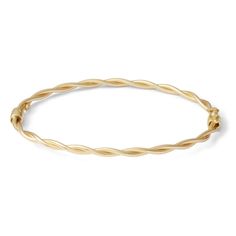 Bring instant sophistication to any style with this luxe and lovely bangle. In 10K gold, this look features an elegant braid of polished twist ribbons. The bangle measures 7 inches in circumference and secures with a tongue and groove clasp. Yellow Gold Braided Bangle Bracelet As Gift, Formal Yellow Gold Bangle With Modern Twist, Adjustable Gold Braided Bangle Bracelet, Modern Twist Yellow Gold Bangle Bracelet, Gold Hand-strung Braided Bracelets, Twisted Ribbons, Tongue And Groove, 10k Gold, Fashion Bracelets